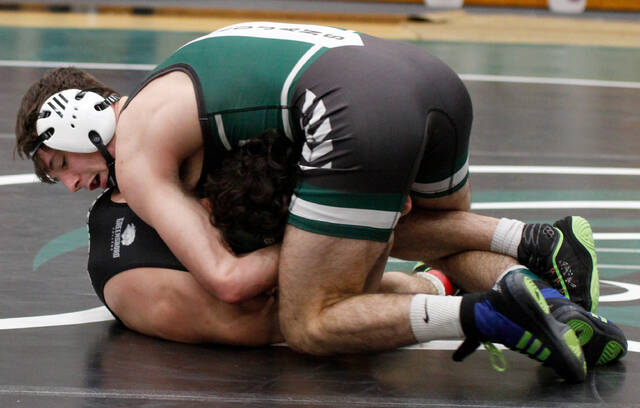 129184546_web1__MG_0752
University of Mount Olive freshman JT Richards, top, works to secure a cradle pin against Greensboro Colleges Ivan Benitez in their 133-pound battle during the Trojan Duals this past Sunday. Richards is one of four UMO matmen to earn an individual national ranking. (Rudy Coggins|mountolivetribune.com)