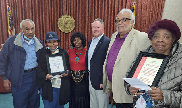 129201057_web1_Honored
The Mount Olive Town Board honored Steve and Gerri Grady, first and second from left, owners of Gradys Barbecue Restaurant in Dudley; and Ed Cromartie, fifth from left, a former Mount Olive commissioner and a former Wayne County commissioner, for their service to the community during its Dec. 13 session. The awards were presented by town Commissioner Vicky Darden, third from left, and Mayor Kenny Talton, fourth from left. At left is Cromarties wife Hilda (Steve Herring|mountolivetribune.com)