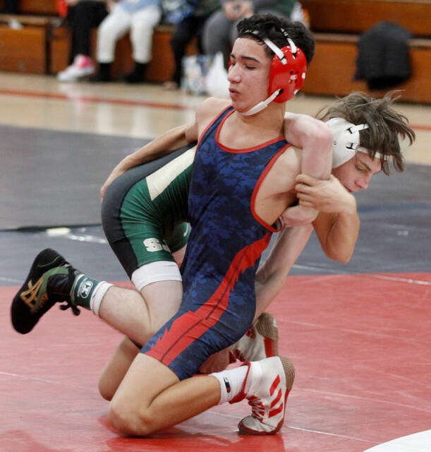 129290605_web1_QCC-1
Southern Wayne freshman Omar Soler Sanchez, front, tries to break free from South Johnstons Ethan Brownlee during their championship battle at 106 pounds in the Quad County 3A wrestling tournament Saturday. Brownlee pinned Sanchez 41 seconds into the second period. (Rudy Coggins|mountolivetribune.com)