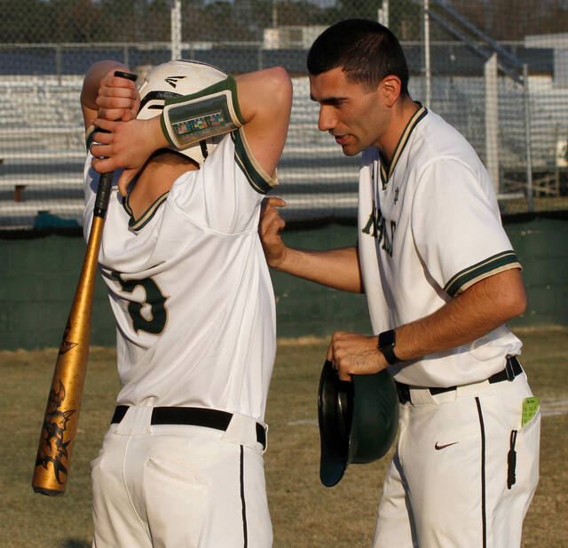 129414140_web1_RebelsBB
Second-year North Duplin head baseball Colton Chrisman talks with Hunt Pate before an at-bat. The Rebels improved to 2-0 with a 5-2 win over East Duplin on Thursday evening. (Rudy Coggins|mountolivetribune.com)