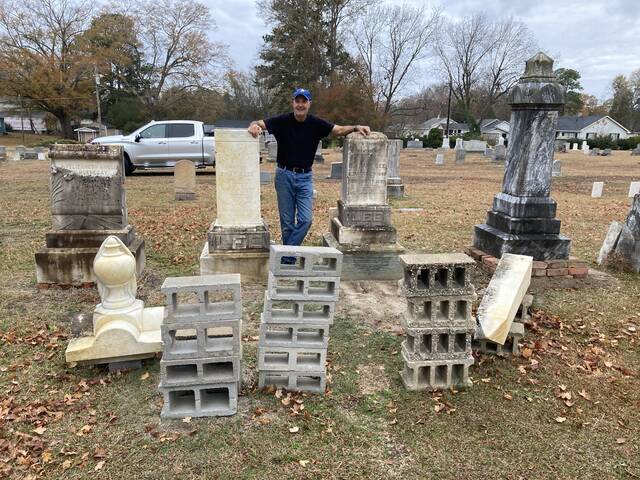 129498403_web1_cemetery-followup-1
Last December, Dick Cobb stood between the two largest tombstones in need of repair in the historic Myrtle Grove section of Maplewood Cemetery. At that time, both monuments had been partially disassembled in preparation for cleaning and repair.(Kathy Grant Westbrook|mountolivetribune.com)
