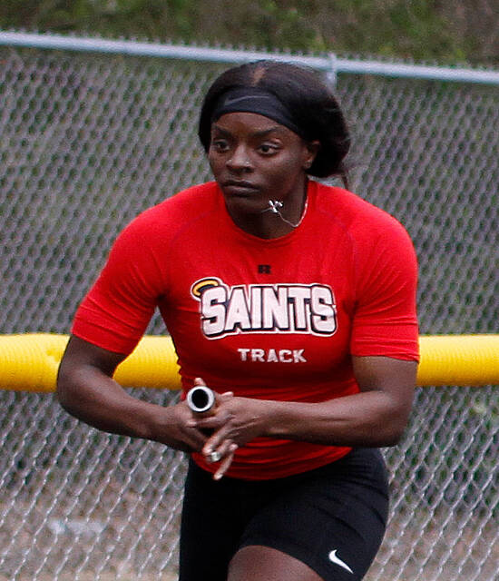129525451_web1_Ta-NiyahGlaspie
Southern Wayne senior sprinter TaNiyah Glaspie shifts the baton to her left hand and completes the final leg of the 4x2 relay, won by the Saints during the recently-contested 2023 Wayne County Track and Field Championship meet. (Rudy Coggins|mountolivetribune.com)