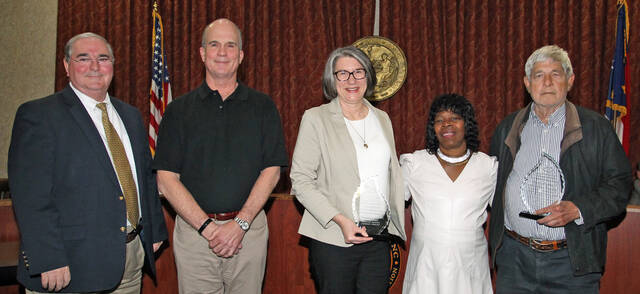 129552750_web1_Honored
The Mount Olive Town Board honored the Mt. Olive Pickle Co. and the First United Methodist Church Peanut Crew for their service to the town and community at its Tuesday, April 11, sesssion. From left are Steve Wiggings, Mayor Pro-tem; Bill Bryan, Mt. Olive Pickle Co. executive chairman; Lynn Williams, company public relations manger; Commissioner Vicky Darden, who established the program to recognize community service; and Martin Weeks of the Peanut Crew.