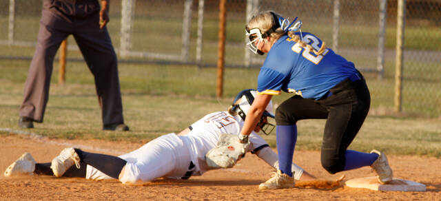 129561876_web1_SaintsEW7
East Wake first baseman Braden Measley tags out Southern Waynes Jocelyn Bond, left, as she dives back to the bag after dropping a base hit into right field. Bond was injured on the play. (Rudy Coggins|mountolivetribune.com)