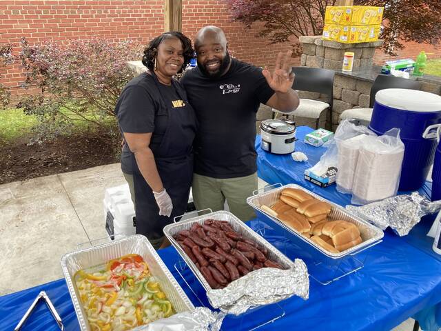 129595833_web1_food-bev-1
Daniel Carlton, owner of DC Kutz & Styles in downtown Mount Olive, closes his barbershop on Pickle Festival day and temporarily becomes a food vendor, enlisting the help of his wife, Tunika, to sell sausage dogs to festival-goers.(Kathy Grant Westbrook|mountolivetribune.com)