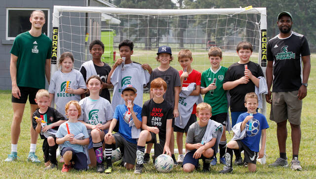 129720737_web1_FaisonSoccerCamp
University of Mount Olive head mens soccer coach Ian Spooner, far right, conducted a three-day soccer camp through the Faison Parks & Recreation Department. UMO rising sophomore Colby Thompson, far left, assisted Spooner. (Rudy Coggins|mountolivetribune.com)
