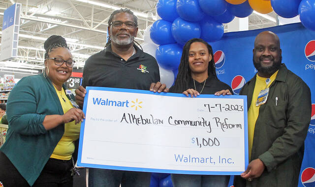 Walmart staff welcomes customers to remodeled Richardson location