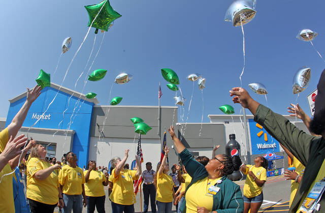 Walmart staff welcomes customers to remodeled Richardson location