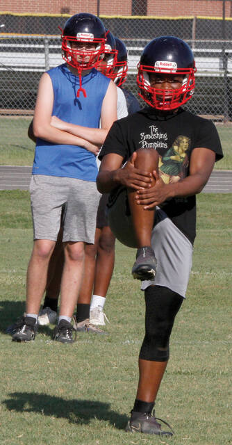 129871764_web1_TylerSpeight
Tyler Speight begins stretching exercises during Southern Waynes preseason football workout. Watching from behind is teammate Matt Whitley. (Rudy Coggins|mountolivetribune.com)