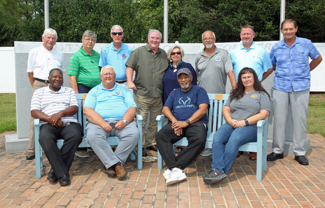129874786_web1_Memorial-4
The Exchange Club of Mount Olive has donated two new benches for the Mount Olive Veterans Memorial on West Main Street across from Steele Memorial Library. The benches were presented Wednesday, Aug. 2, following a meeting of the Mount Olive Veterans Memorial Committee. Seated from left, on the new benches, are: Harlie Carmichael, committee member; and Exchange Club members Joe Scott, Al Southerland, who also is a committee member, and Belinda Parent. Standin, from left, are: Gordon Coombs of McLamb Monument Co., who is working with the committee; Exchange Club members Lynwood Herring, Gary Barefoot, Steve Wiggins, who is also the committee chairman, and his wife, Hazel Wiggins, Michael Thompson and James Kornegay; and Ray Harrell, committee member. (Steve Herring|mountolivetribune.com)