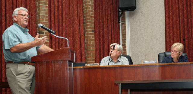 129977233_web1_Harris
The Mount Olive Town Board has agreed to seek an additional $200,000 in funding for the towns downtown revitalization project. Consultant David Harris, left, of RSM Harris Associates of Goldsboro, explains the request during a Tuesday night, Sept. 13, public hearing. From left are Harris, Town Attorney Carroll Turner and Commissioner Barbara Kornegay. (Steve Herring|mountolivetribune.com)