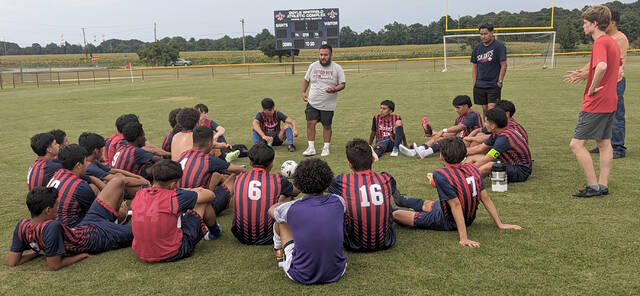 129998747_web1_SWsoccer
Southern Wayne head boys soccer coach Luis Ramirez, gray shirt, talks with his team after a recent game. The Saints defeated South Johnston, 7-1, on Wednesday evening. (Rudy Coggins|mountolivetribune.com)