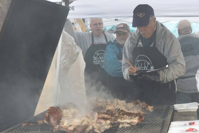 130012591_web1_Pickle-Pigs--Swigs-80
Cook-off Judge Charlie Martin judges a Pickles, Pigs & Swigs entry during the 2022 Pickles, Pigs & Swigs. This years event returns Nov. 10-11 in downtown Mount Olive.