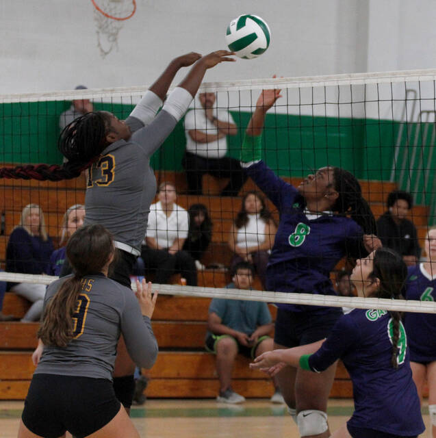 130052375_web1_SCGoldsboroVB
Goldsboros Aziah Boyer (13) dumps over a block attempt by Spring Creeks Graddie Miteu (9) during their Neuse Six 2A volleyball contest Tuesday afternoon. Covering on the play are Spring Creeks Rebekah Rios (8) and Goldsboros Addison West (9). (Rudy Coggins|mountolivetribune.com)