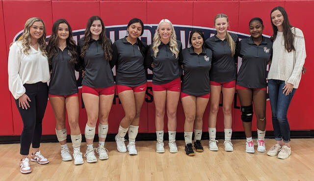130057839_web1_Saintsvolleyball
Southern Wayne head volleyball coach Hannah Sladick Walker, far right, and assistant coach Daelyn Brock, left, stand with their seven seniors prior to their regular-season finale against Charles B. Aycock Thursday evening. (Rudy Coggins|mountolivetribune.com)
