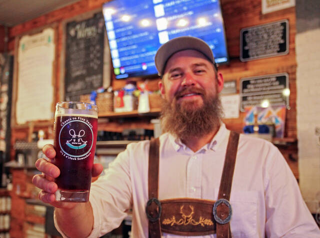 130067071_web1_RR-1
Ryan Roberts, owner of R&R Brewing, holds one of the commemorative glasses given away during the companys fifth-anniversary celebration held Saturday, Oct. 14. (Steve Herring|mountolivetribune.com)