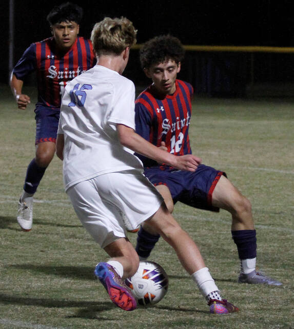 130092369_web1_SaintsCBA1
Southern Waynes Jesus Giron Castillo (12) defends against Charles B. Aycocks Gregory Smith during first-half action Wednesday evening. (Rudy Coggins|mountolivetribune.com)