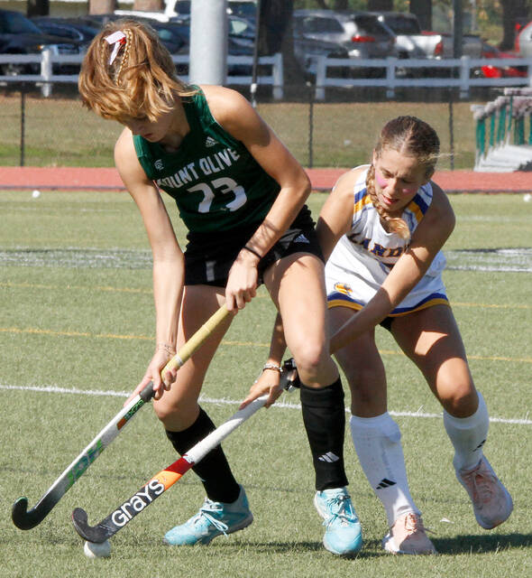130100443_web1_UMOFH
A Lander player attempts to take the ball away from University of Mount Olive sophomore defender Maud van Duin during first-half action of their South Atlantic Conference field hockey game Saturday afternoon. (Rudy Coggins|mountolivetribune.com)
