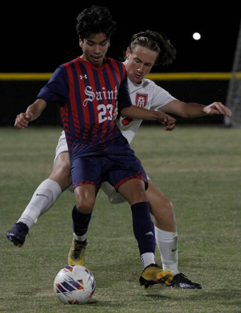 130105943_web1_SaintsRams4
Southern Waynes Ivan Alvarado, who scored the games opening goal, keeps possession against a Franklinton defender Monday evening. (Rudy Coggins|mountolivetribune.com)