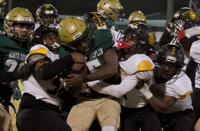 130118499_web1_NDPamlico6
North Duplin senior running back DuJuan Armwood (with ball) is brought down by a number of Pamlico County tacklers during first-half action Friday evening. (Rudy Coggins|mountolivetribune.com)
