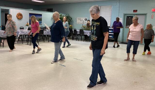 130133874_web1_line-dancing-1
Members of the Mount Olive Parks and Recreation Departments line dancing class learn the steps to Got to Be Funky. From left are: Jan Troehler, Jeannie Sutton, instructor Patricia Curtis, Lisa Daughtry, Frances Jones, Neicy Weeks, Sheila Sutton and Teresa Rose. The class meets on Tuesday evenings, 6-7 p.m., and all are welcome. (Kathy Grant Westbrook|mountolivetribune.com)