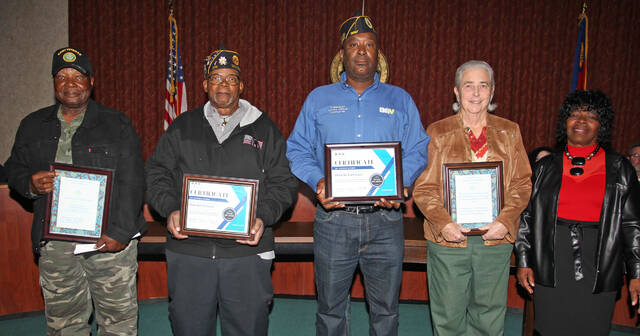 130147907_web1_Honored
Mount Olive Commissioner Vicky Darden, far right, paid tribute to several people during the town boards Tuesday, Nov. 14, session. From left are: Harlie Carmichael, veteran, former town commissioner and member of the Mount Olive Veterans Committee; Norman Moore, a member of Bryant-Best American Legion Post 215, who accepted a certificate on behalf of the late Donald Wooten, who was remembered by Darden; Alonzo Albertson, commander of the Donald H. Kirkman Chapter 45 of Disabled American Veterans, who accepted the honor on behalf of the organization; and Lynn Joyner, who was honored for her work with the Mount Olive Veterans Memorial Committee fundraiser. (Steve Herring|mountolivetribune.com)