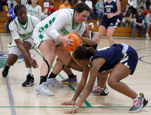 130166795_web1_SCgirls3
Spring Creeks Vanessa Duruttya comes up with a loose ball while teammate Trinity Daniels, left, assists from behind during their game against Jones Senior Tuesday evening. (Rudy Coggins|mountolivetribune.com)
