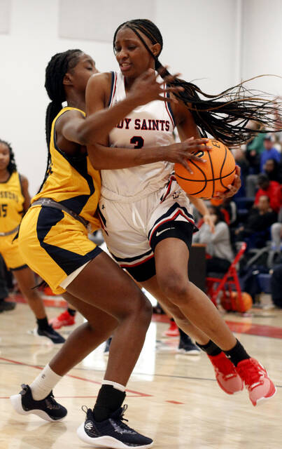 130219793_web1_SWG3
Southern Wayne junior point guard Nevaeh Hines-Bass, right, gets fouled by Goldsboros DesMyah Croom on a drive to the basket Tuesday evening. (Rudy Coggins|mountolivetribune.com)