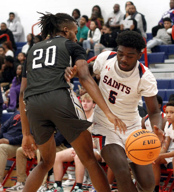 130228868_web1_SWEWB3
Southern Wayne freshman guard Kairel Evans (5) drives past Eastern Waynes Charlie Thomas toward the basket during second-half action Friday evening. Evans scored 19 points. (Rudy Coggins|mountolivetribune.com)