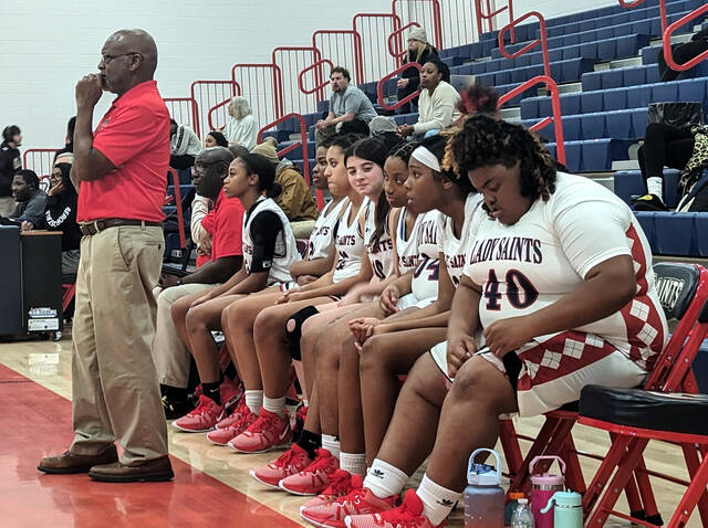130304685_web1_SaintsBKB1
Southern Wayne head coach Ricky Lofton, left, watches his team during first-half play against Smithfield-Selma Tuesday evening. (Rudy Coggins|mountolivetribune.com)