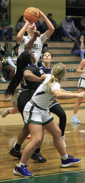 130349552_web1_NDNCG4
North Duplins Addy Higginbotham takes a shot over Neuse Charter defender Nivea Winston, middle, while teammate Lilly Fulghum looks on during second-half action Friday evening. (Rudy Coggins|mountolivetribune.com)