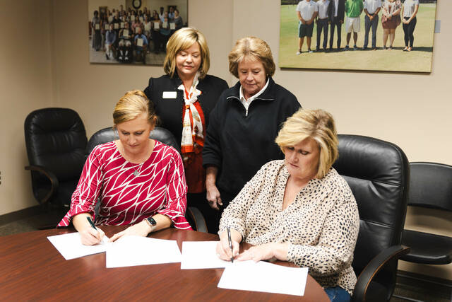 130355032_web1_UMO_9097-Enhanced-NR
Owners of GAP Ready! Farm Services, Inc. Paula Manning (seated right) and Leigh Page are pictured signing the GAP Ready scholarship agreement as Vice President of Institutional Advancement Dr. Twyla Wells (standing left) and UMO Special Projects Coordinator Dr. Sandy Maddox look on.