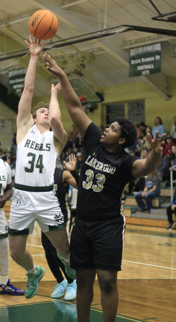 130360235_web1_NDLakeB1
North Duplins Luke Kelly, left, goes up for a shot against Lakewoods Cameron Williams during opening-quarter action Tuesday evening in Calypso. (Rudy Coggins|mountolivetribune.com)
