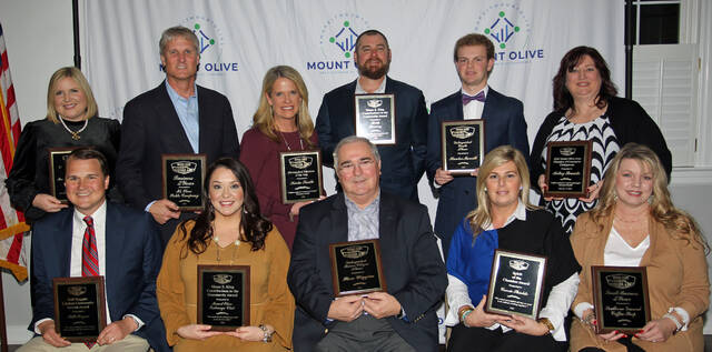 130362702_web1_Chamber-awards
The Mount Olive Area Chamber of Commerce held its annual banquet and awards ceremony Feb. 6 at the Southern Wayne Country Club. Front row, left to right, are Byron Bryan who accepted the Ruff Huggins Community Service Award on behalf of his father, Bill Bryan; Amberley Davis, who accepted the Moses E. King Contributions to the Community Award on behalf of the Exchange Club of Mount Olive; Steve Wiggins, Distinguished Senior Citizen Award; Carrie Shields, Spirit of the Chamber Award; and Amy Brogden, who accepted the Small Business of the Year Award on behalf of Southern Ground Coffee Shop. Back row, left to right, are Melissa Kilpatrick, Lillian B. Langley Award; Larry Beckman, who accepted the Business of the Year Award on behalf of Mt. Olive Pickle Co.; Karla Smith, Distinguished Educator Award; Ryan Roberts, who accepted the Moses E. King Contributions to the Community Award on behalf of R&R Brewing; Hunter Merritt, Distinguished Youth Award; and Kelley Thwaite, who was honored as outgoing Chamber board chairperson. (Steve Herring|mountolivetribune.com)