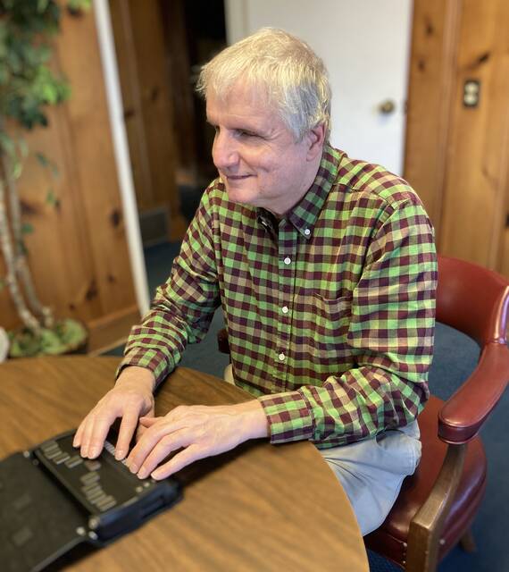 130364480_web1_spoken-word-1
Tim Snyder, president of the non-profit Spoken Word Ministries, demonstrates how to use an eReader or Refreshable Braille Display. Volunteers are needed to prepare books to be loaded onto eReaders for use by the blind and visually impaired. (Kathy Grant Westbrook|mountolivetribune.com)