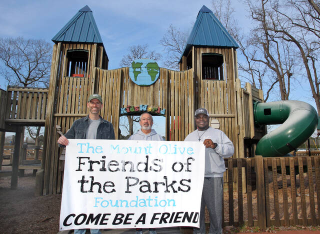 130406243_web1_Friends
Volunteers are being encouraged to help clean up and make repairs at Westbrook and Nelson Street parks from 9 a.m. to 1 p.m. Saturday, March 2, when Mount Olive Friends of the Parks holds a community workday at the two parks. The public also is being invited to attend the Friends of the Parks meeting at 6 p.m., Thursday, March 21, that will be hosted by Mount Olive American Legion Post 103 on North Chestnut Street. From left, Josh Phillips, Mount Olive Parks and Recreation director; Tony Martin, Friends of the Parks president; and Donta Lewis with Mount Olive Parks and Recreation, pose in front of the Kids World Playground at Westbrook Park. (Steve Herring|mountolivetribune.com)