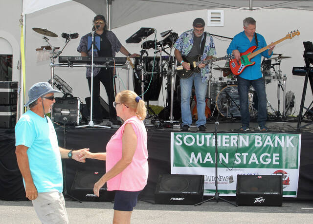 130414789_web1_Main-stage
The second day of the 38th annual N.C. Pickle Festival will boast four stages of entertainment this year instead of three. The award-winning festival will be held in downtown Mount Olive from 5 p.m. to 10 p.m. Friday, April 26, and from 9 a.m. to 6 p.m. Saturday, April 27. Festival-goers dance in front of the main stage during the 2023 festival. (Steve Herring|mountolivetribune.com)