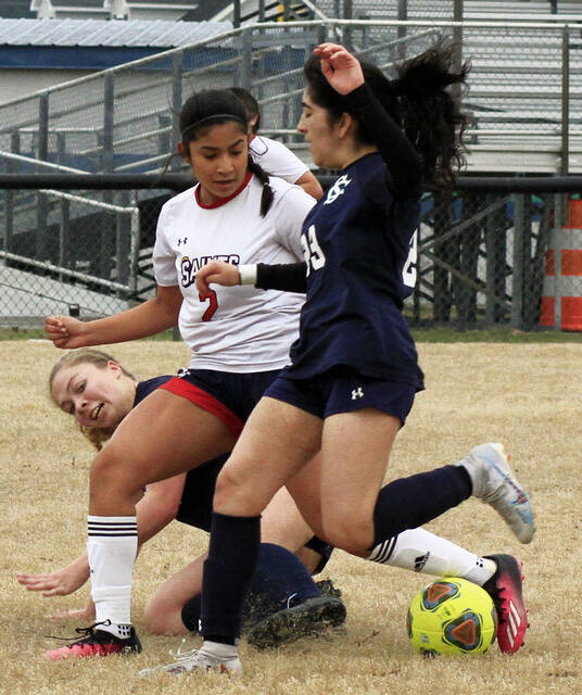 130424830_web1_SWGSOC
Spring Creeks Gabriella Sutton, back, and teammate Emily Reyes-Melendez (23) try to take the ball away from Southern Waynes Allya Segura during first-half play Friday afternoon. (Rudy Coggins|mountolivetribune.com)