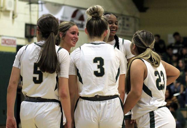 130424841_web1_NDGirlsA
North Duplins Addy Higginbotham (5), Reece Outlaw, Tateyawna Faison, Meghan Martin (3) and Mchelle Jaco talk during a timeout against Roxboro Community School. The Rebels season ended with a loss at East Columbus on Friday evening. (Rudy Coggins|mountolivetribune.com)