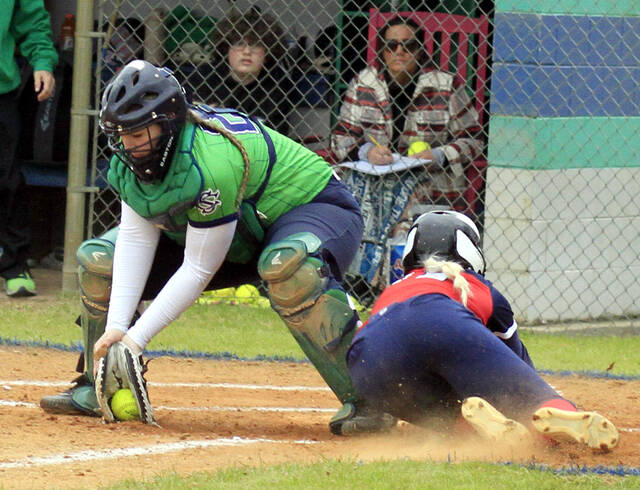130424848_web1_SWSOFT1
Southern Wayne senior Gracie Hinson scores ahead of the tag by Spring Creek catcher Heather Alexander during early-inning action Friday afternoon at The Swamp. (Rudy Coggins|mountolivetribune.com)