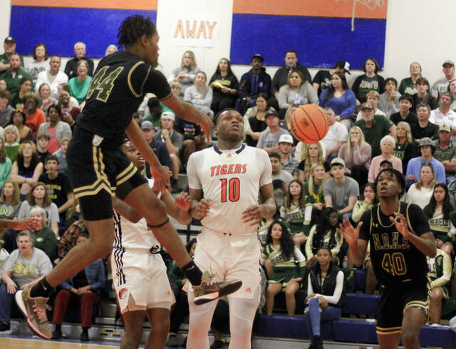 130435504_web1_NDWPA5
North Duplins Donovan Armwood (44) draws Wilson Prep defender David Ellis into the paint and dishes the ball off to teammate Micah Lesesane during second-half play Tuesday. (Rudy Coggins|mountolivetribune.com)