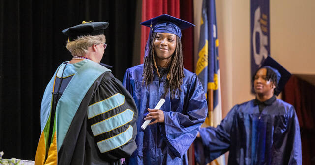 130619582_web1_TPCC-Grad-Social
Adult High School graduate Malasia Artis receives a high school diploma during the recently held commencement ceremony. (Photo courtesy WCC)