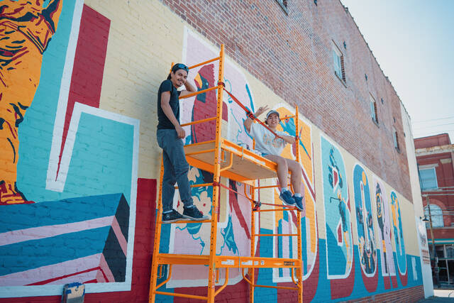 130790501_web1_P1082210
Celeste Aguirre Onate and Luis Fernando Henriquez, both graduates of the University of Mount Olive, are alumni of the schools art programs and painted a mural in downtown Goldsboro.