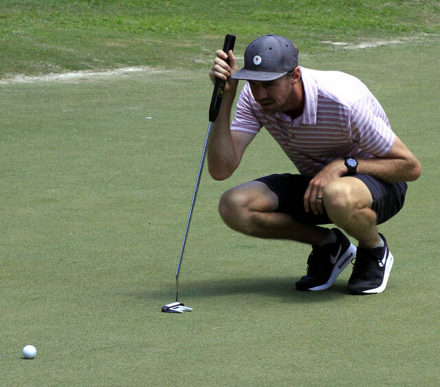 130791798_web1_EricWilliams
Eric Williams lines up a putt on the No. 1 green at Goldsboro Golf Course on Sunday afternoon. Williams birdied the hole and eventually won the 2024 Wayne County Amateur Golf Open Division championship. (Rudy Coggins|mountolivetribune.com)