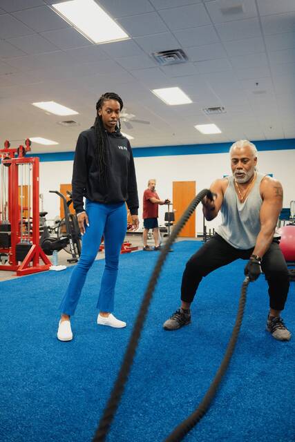 130828268_web1_P1010943
Working part-time at Clayton Fitness and Teen Xtreme in Raleigh, Vinesha Briggs gains valuable hands-on experience in the fitness industry. (UMO photo)