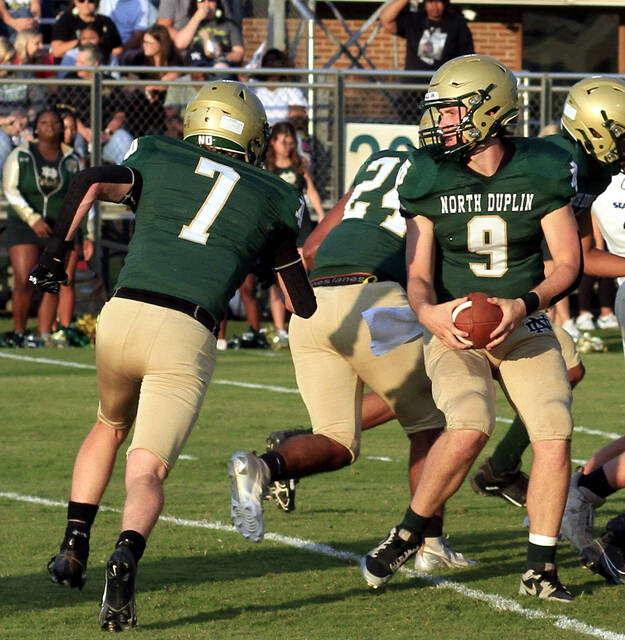 130911565_web1_NDCarter
North Duplin quarterback Luke Kelly (9) flips the ball to running back Vance Carter (7) during a game earlier this season. Carter scored a touchdown during the Rebels road conquest of Lejeune. (Rudy Coggins|mountolivetribune.com)