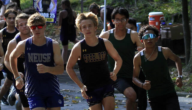 130939017_web1_Carolina1AXCa
Neuse Charters Noah Highfil, left, Rosewoods Gage Lewis, center, and North Duplins Jerrson Lopez, right, lead the pack at the start of Tuesday afternoons Carolina 1A cross country meet at Cliffs of the Neuse State Park. (Rudy Coggins|mountolivetribune.com)
