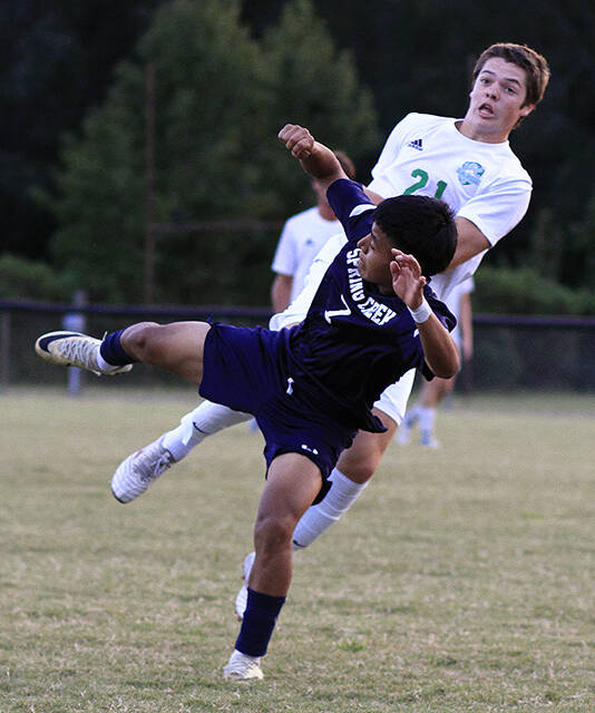 130961343_web1_CreekBSOC
Spring Creeks Diego Morales (7) and J.H. Roses David McAlduff collide after Morales sends the ball upfield during a match earlier this season. The Gators defeated Goldsboro, 3-0, Thursday evening. (Rudy Coggins|mountolivetribune.com)