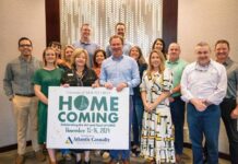 
			
				                                Pictured on the front row holding the University of Mount Olive/Atlantic Casualty Insurance Company Homecoming Sponsorship Board are UMO Homecoming Coordinator Christal Howell, UMO Vice President for Advancement Dr. Twyla Wells, and Atlantic Casualty CEO Brett Strickland. They are surrounded by Atlantic Casualty employees who are also UMO alumni. (UMO photo)
 
			
		