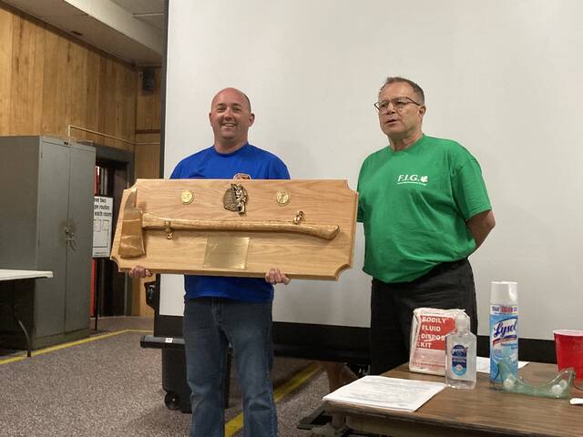 130989735_web1_IMG_1408
On behalf of Faison Fire & Rescue, Fire Chief Lee Kennedy (left) accepts a plaque from the Faison Improvement Group, presented by FIG member Mike Stempek. The plaque made its way to the small Duplin County town from Prudhoe Bay, Alaska, and was given in appreciation for the many ways in which Faison Fire & Rescue contributes to the community. (Kathy Grant Westbrook|mountolivetribune.com)
